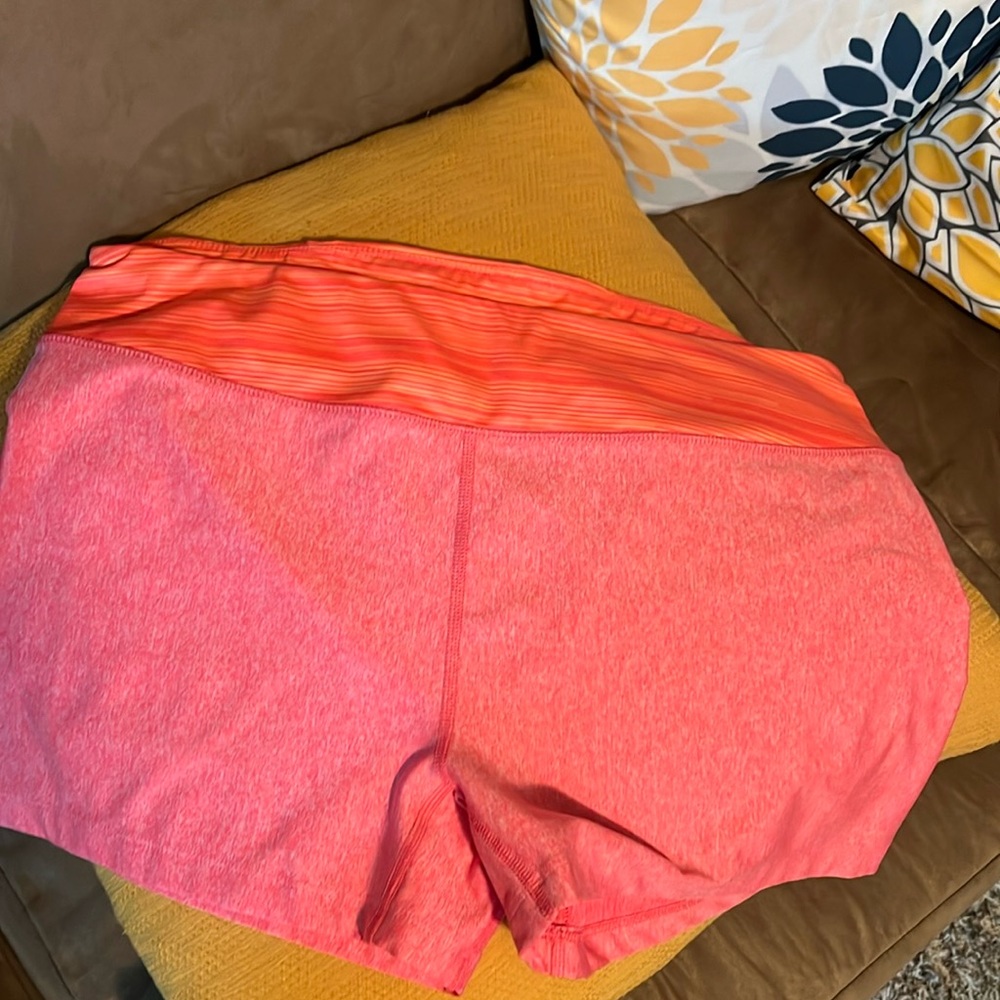 Under armor fitted shorts like new pink and orange